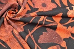 Jerseyprint Blumen schwarz orange gedreht