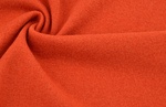 Merinostrick orange gedreht